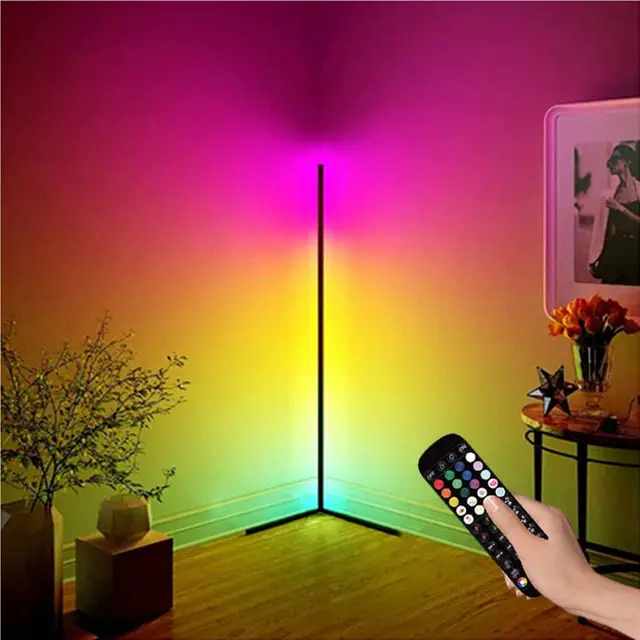 Colorful LED floor lamp with remote control in a room setting